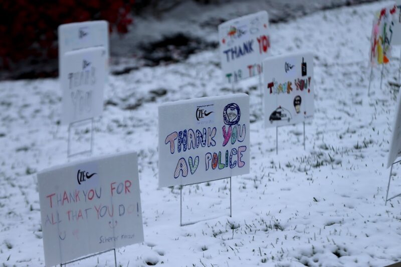 Thank you AV Police signs in yard with snow